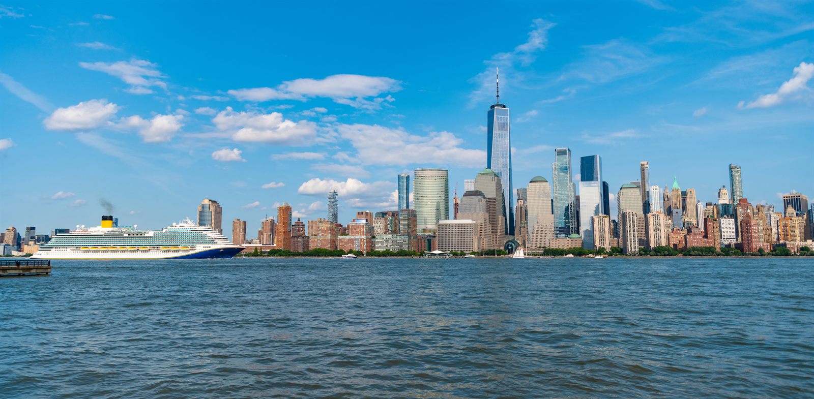 Cruise ship sailing past the Lower Manhattan skyline