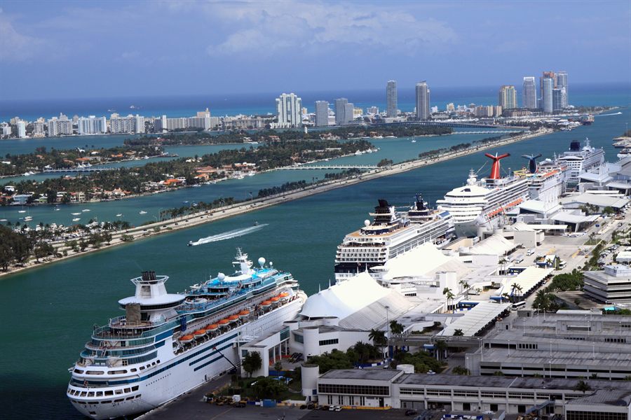 Cruise terminals and docked ships along a port channel